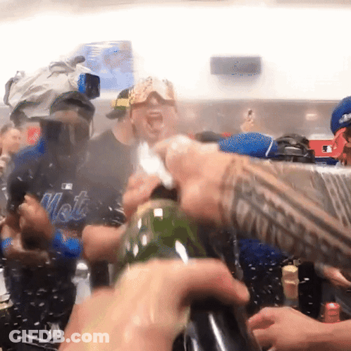 Man In Mets Shirt Opening Bottle GIF