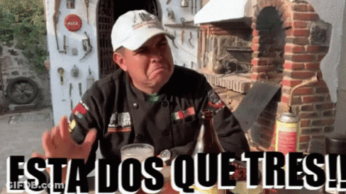 Man In Mexico Sweatshirt In Front Of Vehicles GIF