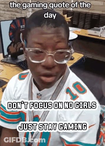 Man In Miami Dolphins Jersey At Desk GIF
