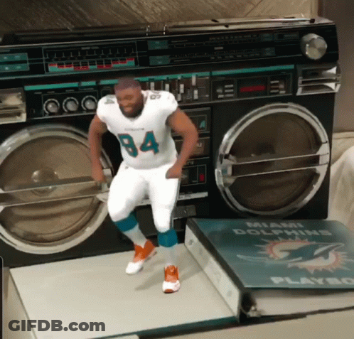 Man In Miami Dolphins Jersey Dancing In Front Of Boom Box GIF