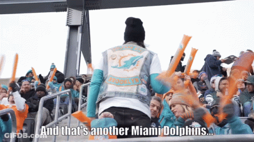 Man In Miami Dolphins Vest Standing In Front Of Crowd GIF