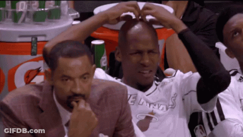 Man In Miami Heat Jersey Sitting In Stands GIF