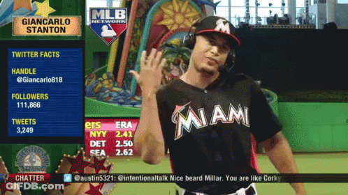 Man In Miami Jersey Waving In Front Of MLB Network Sign GIF