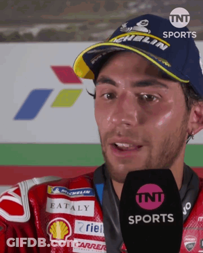 Man In Michelin Hat Talks Into Microphone GIF