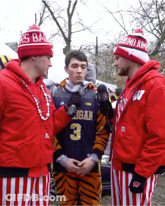Man In Michigan Jersey Being Interviewed GIF