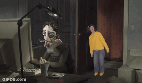 Man In Michigan State Shirt Looking At Computer GIF