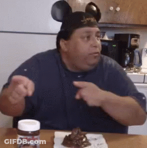 Man In Mickey Mouse Ears Sitting With Nutella GIF