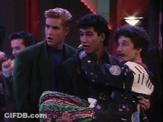 Man In Mickey Mouse Jacket Holding Another Man GIF