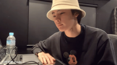 Man In Mickey Mouse Shirt Sitting At Laptop GIF