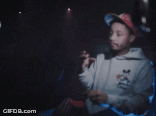 Man In Mickey Mouse Sweatshirt Pointing At Gun Saying I Got The On Me Right Now GIF