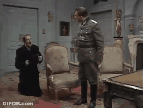 Man In Military Talking To Man In Black Robe GIF