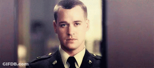 Man In Military Uniform And Tie Looking At Camera GIF