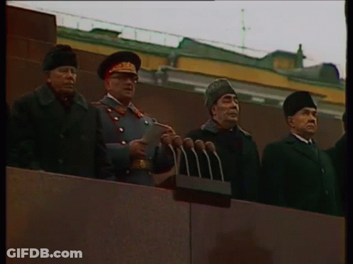 Man In Military Uniform At Microphones GIF