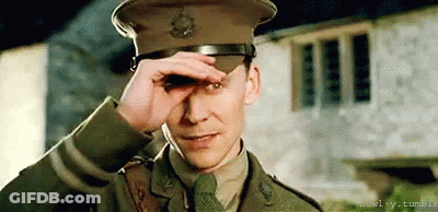 Man In Military Uniform Covering Eyes GIF