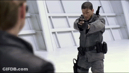 Man In Military Uniform Holding Gun GIF