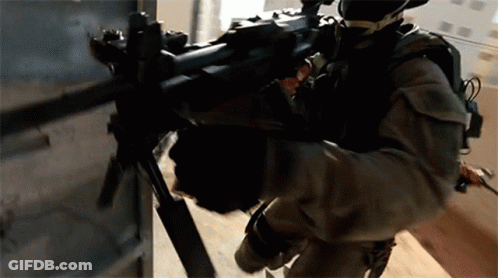 Man In Military Uniform Holding Rifle GIF