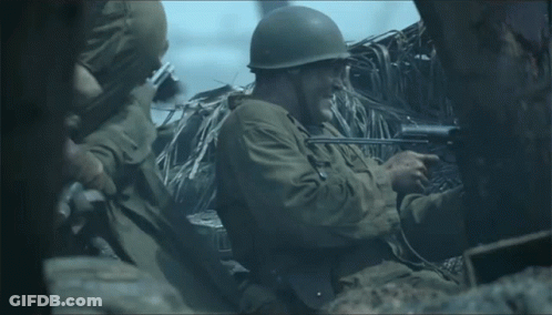 Man In Military Uniform Holding Rifle GIF