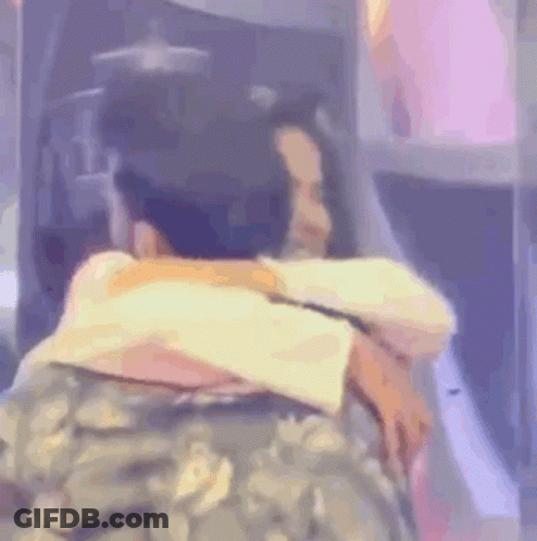 Man In Military Uniform Hugging Woman In Plane GIF
