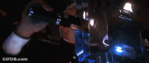 Man In Military Uniform In Dark Room With Blue Lights GIF