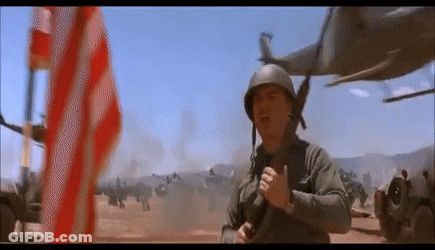 Man In Military Uniform In Front Of American Flag GIF