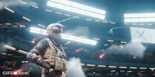 Man In Military Uniform In Stadium With Smoke GIF