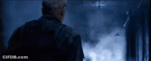 Man In Military Uniform Looking In Dark Room GIF