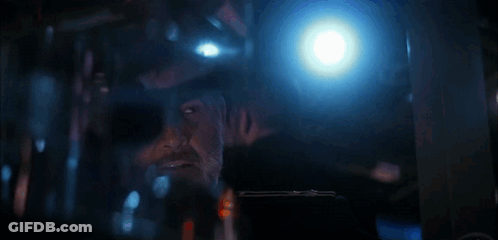 Man In Military Uniform On Boat Looking At Camera GIF