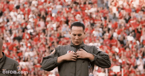 Man In Military Uniform On Football Field GIF