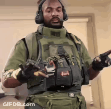 Man In Military Uniform Pointing At Camera GIF