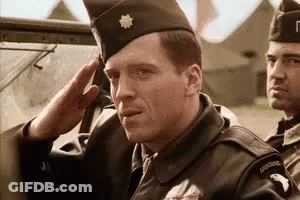 Man In Military Uniform Saluting In Car GIF