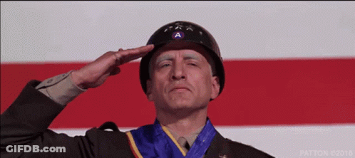 Man In Military Uniform Saluting With Medal GIF