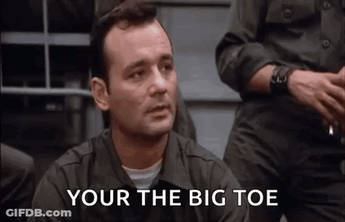 Man In Military Uniform Sitting Before Group GIF