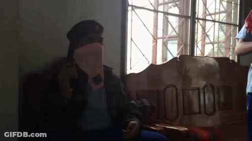 Man In Military Uniform Sitting By Window GIF