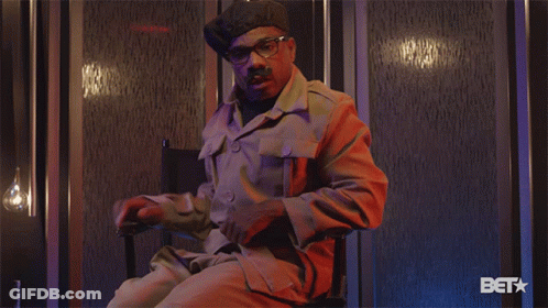 Man In Military Uniform Sitting With BET Logo GIF
