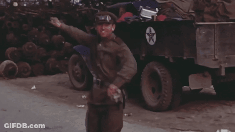 Man In Military Uniform Standing By Truck With Star GIF