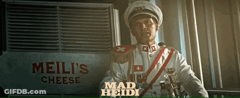 Man In Military Uniform Standing In Front Of Meili's Cheese Sign GIF