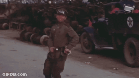 Man In Military Uniform Standing In Front Of Star Truck GIF