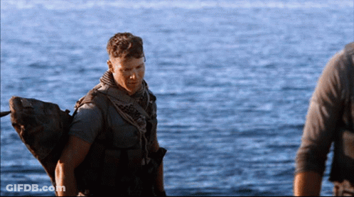 Man In Military Uniform Standing In Water GIF