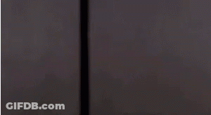 Man In Military Uniform Standing Next To Door GIF