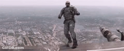 Man In Military Uniform Standing On Building GIF