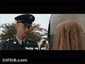 Man In Military Uniform Talking To Woman In Front Of Plane GIF