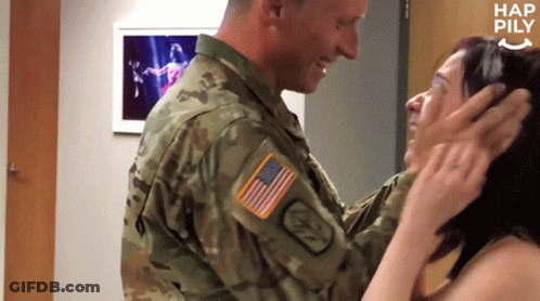 Man In Military Uniform Touching Woman Forehead GIF