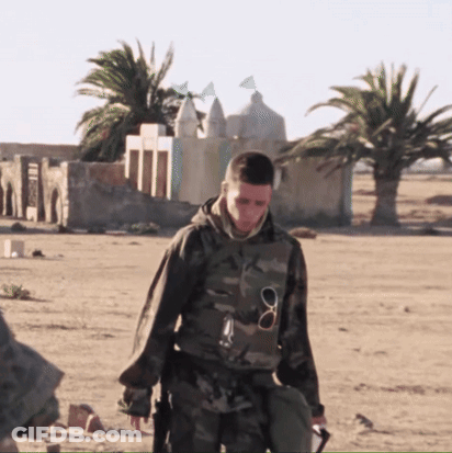 Man In Military Uniform Walking Desert GIF
