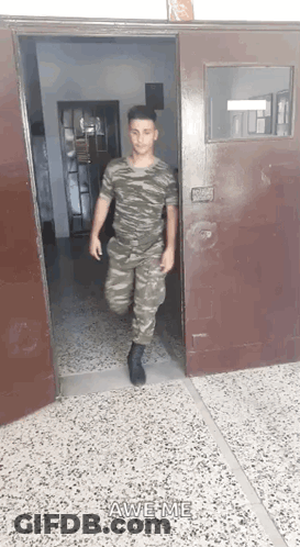 Man In Military Uniform Walking Out Door Saying Awesome GIF