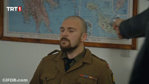 Man In Military Uniform With Map Saying TRT1 GIF