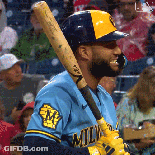 Man In Milwaukee Jersey Holding Bat GIF