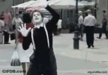 Man In Mime Costume Dancing On Street GIF