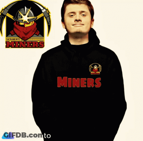 Man In Miners T-Shirt In Front Of Sacramento Miners Logo GIF