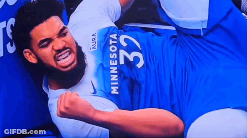 Man In Minnesota 32 Jersey Laying On Ground GIF