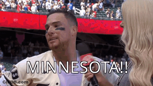 Man In Minnesota Jersey Interviewed By Woman In Crowd GIF